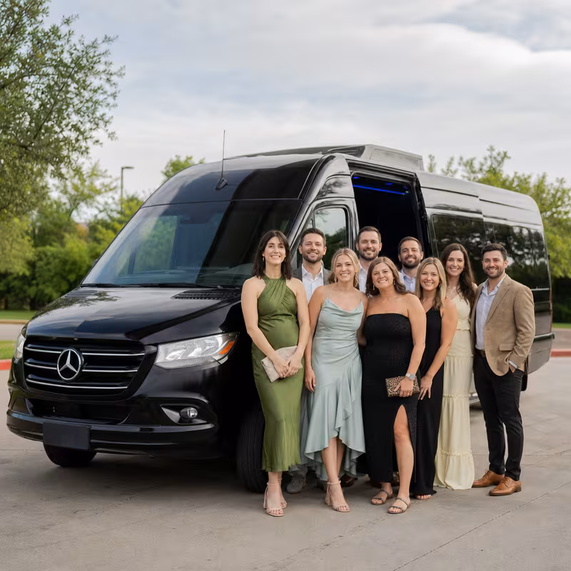 Group beside a Mercedes Sprinter limo from the Arlington fleet