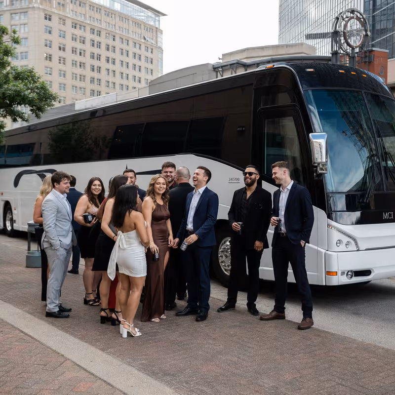 Passengers loading luggage while boarding an Arlington group shuttle
