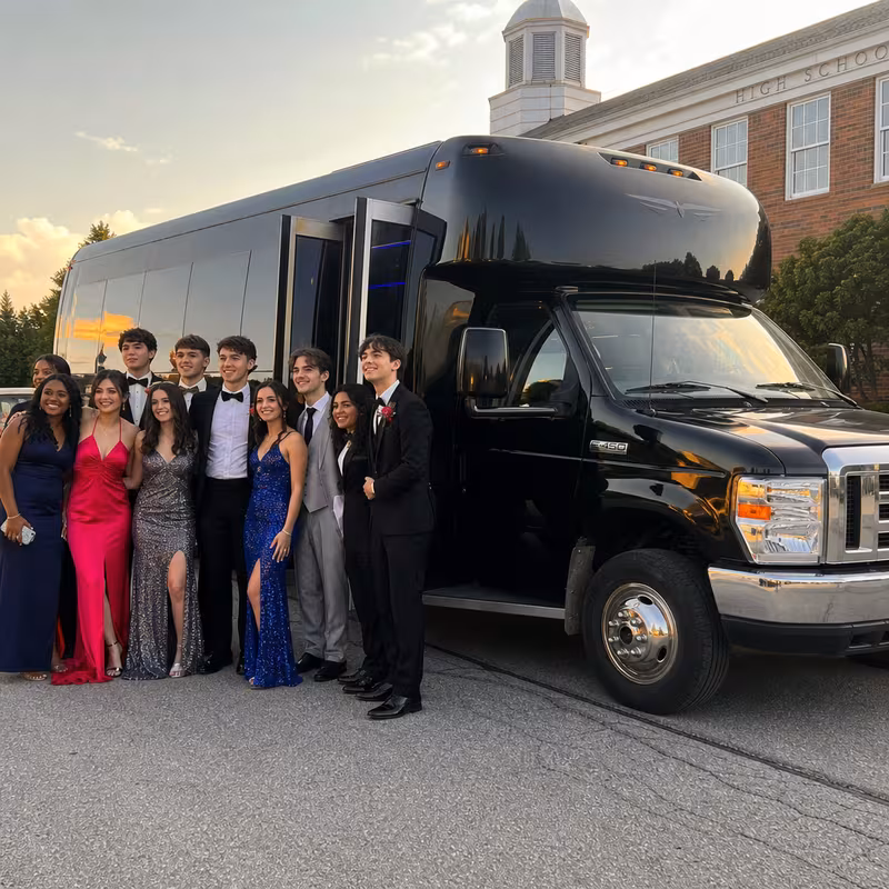 Group boarding a white charter bus for Prom & Homecoming Transportation transportation in Arlington