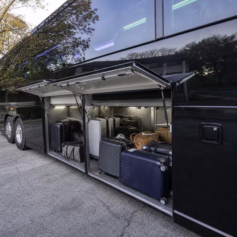 Party bus interior with wraparound leather seating and LED lighting in Arlington
