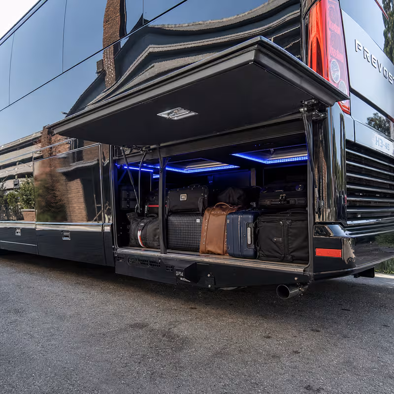 Party bus interior with wraparound leather seating and LED lighting in Arlington