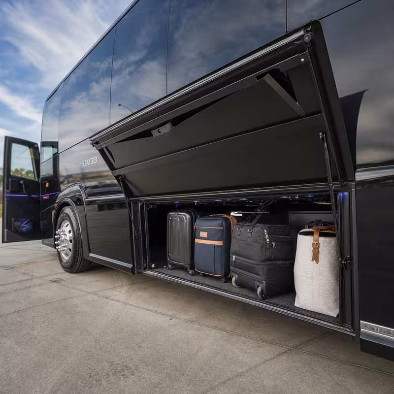 Party bus interior with wraparound leather seating and LED lighting in Arlington
