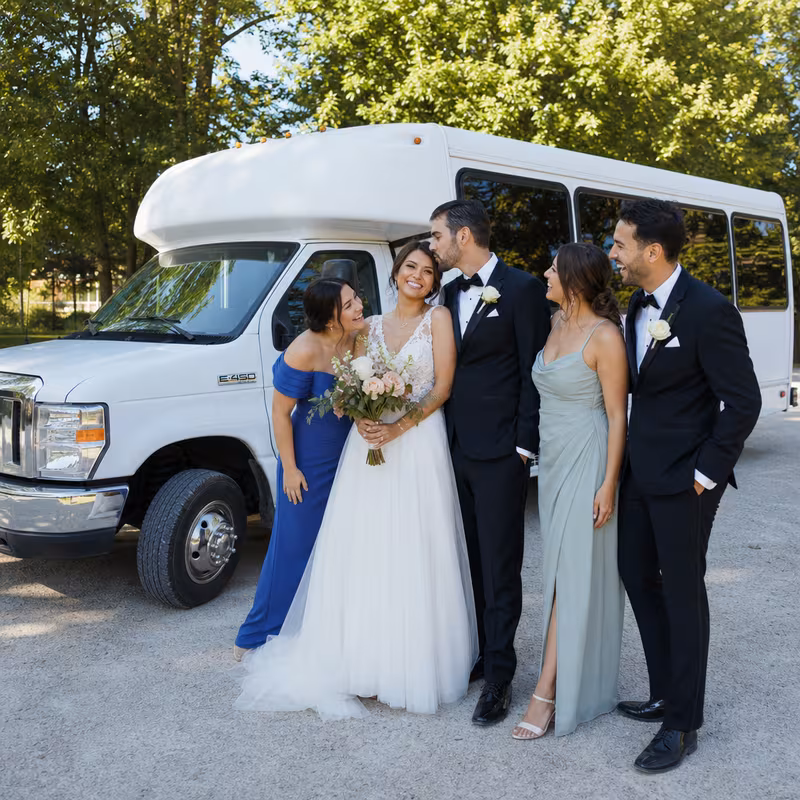 Passengers loading luggage while boarding an Arlington group shuttle